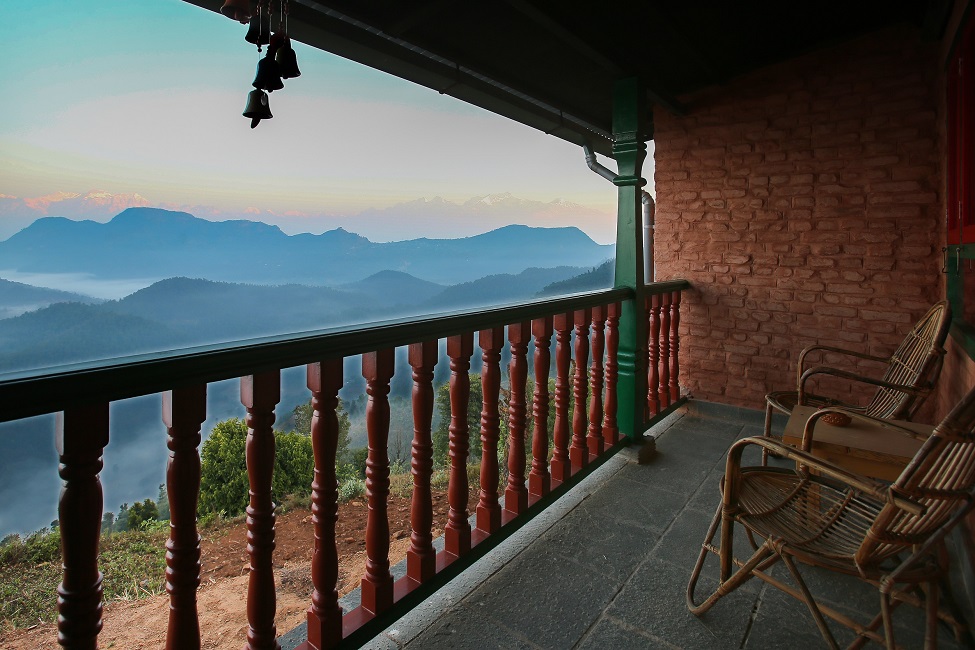 lodge balcony with chairs and mountain view